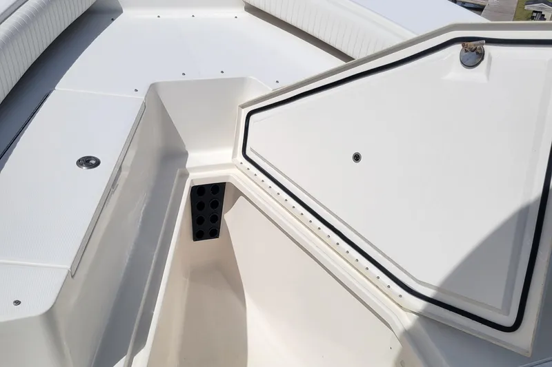 Slide: The Image of 2006 Regulator 29 Forward Seating boat interior with storage compartment. - 9