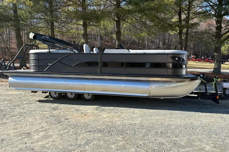 The Image of 2026 Bentley Pontoons 223 NAVIGATOR on trailer, parked in wooded area. - 0
