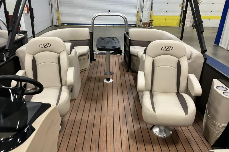 Slide: The Image of 2026 Bentley Pontoons 223 NAVIGATOR helm with steering wheel and Simrad display. - 3
