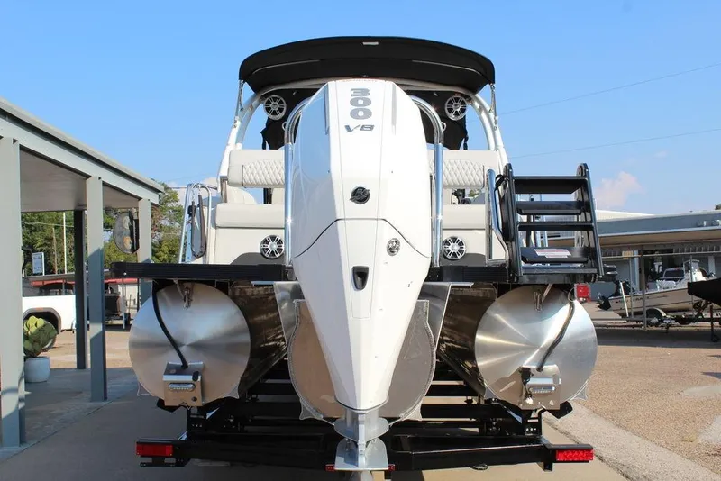 Slide: The Image of 2026 Avalon Excalibur LTD Quad Lounge 25 FT pontoon boat, rear view with powerful engine. - 10