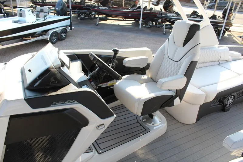 Slide: The Image of Luxurious interior of 2026 Avalon Excalibur LTD Quad Lounge 25 FT boat with plush seating. - 19