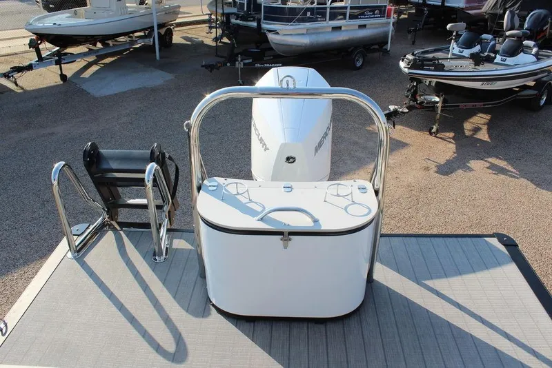 Slide: The Image of 2026 Avalon Excalibur LTD Quad Lounge 25 FT boat with Mercury engine, docked outdoors. - 21