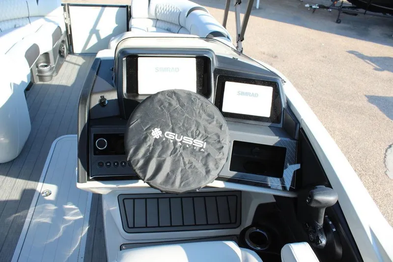 Slide: The Image of 2026 Avalon Excalibur LTD Quad Lounge 25 FT boat dashboard with Gussi steering wheel cover. - 22