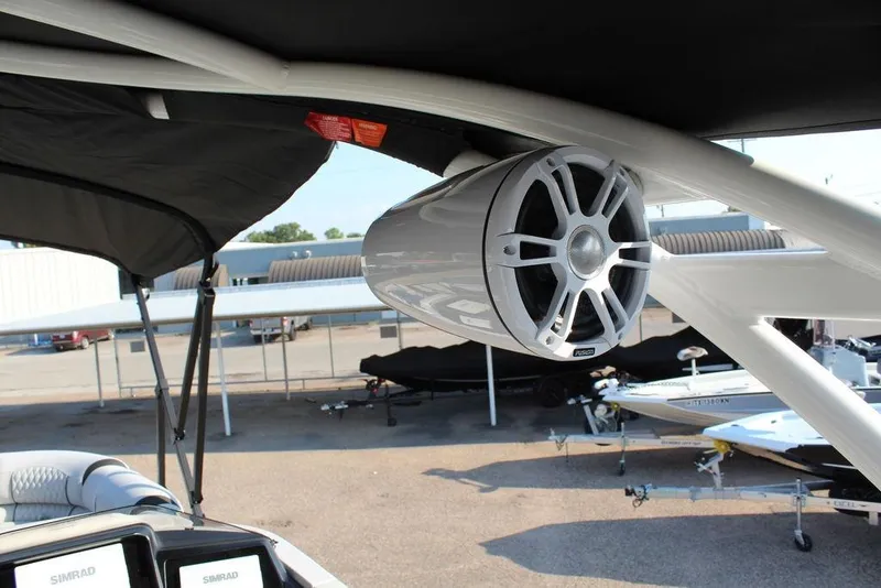 Slide: The Image of 2026 Avalon Excalibur LTD Quad Lounge 25 FT boat with mounted speaker system. - 23