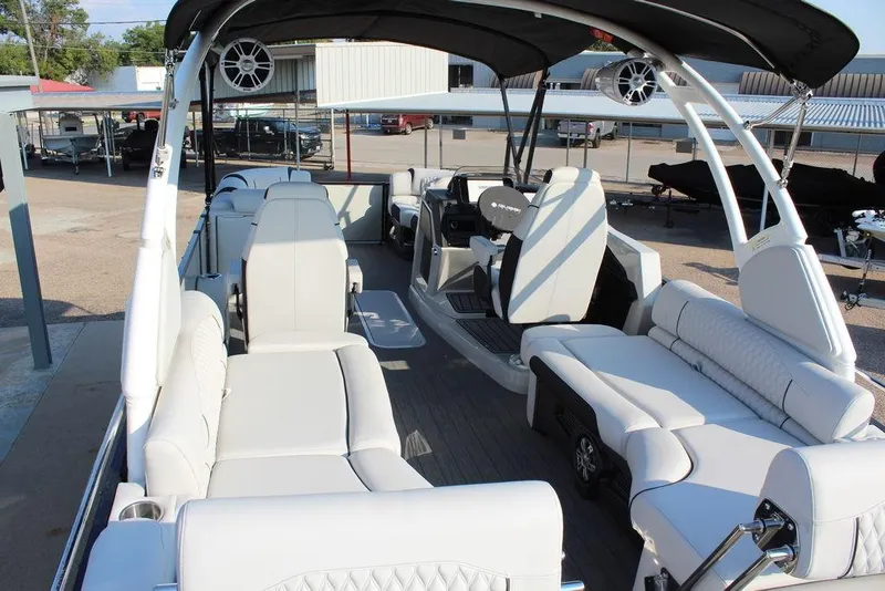 Slide: The Image of 2026 Avalon Excalibur LTD Quad Lounge 25 FT pontoon boat with luxurious seating and modern design. - 27