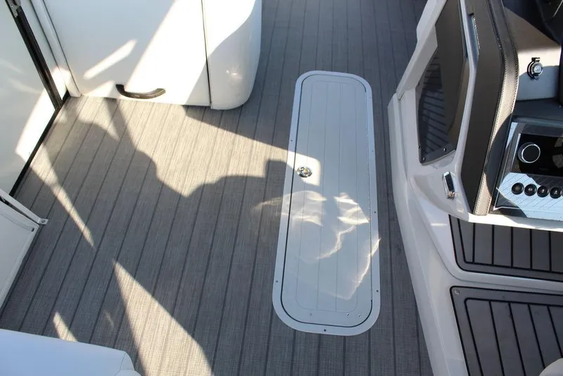 Slide: The Image of 2026 Avalon Excalibur LTD Quad Lounge 25 FT interior with sleek flooring and modern console. - 29