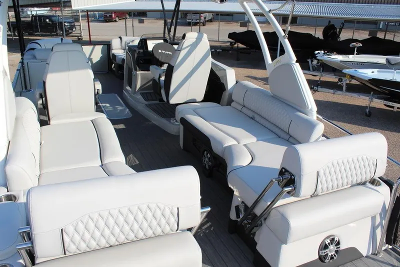 Slide: The Image of Luxurious 2026 Avalon Excalibur LTD Quad Lounge 25 FT pontoon boat interior with plush seating. - 30