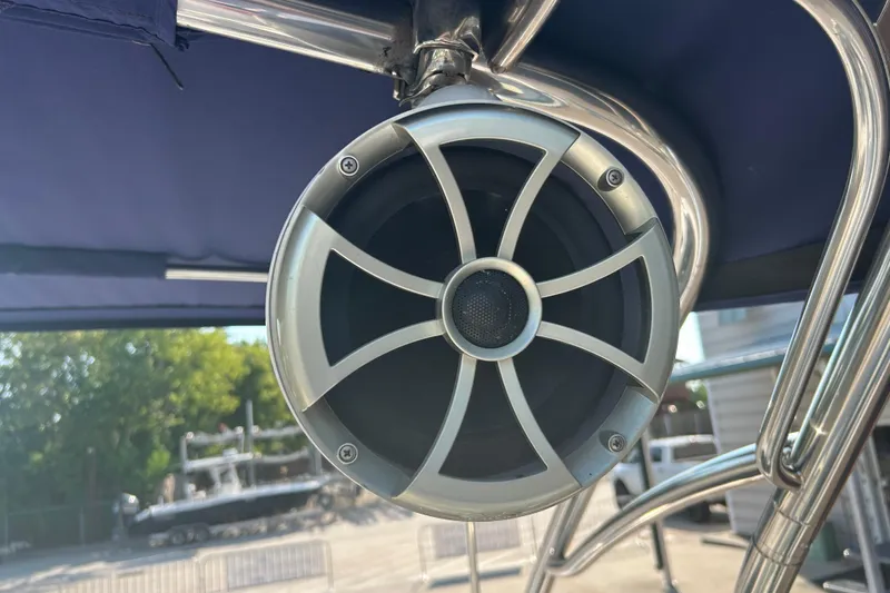 Slide: The Image of Close-up of a speaker on a 2011 Cobalt 242 boat, mounted on metal framework. - 25