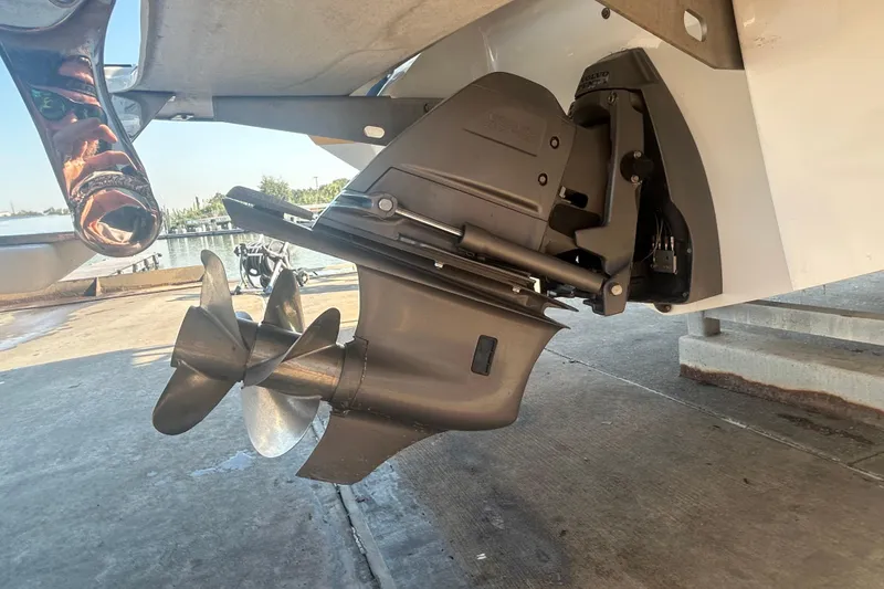 Slide: The Image of 2011 Cobalt 242 boat propeller and outdrive on a concrete surface. - 7