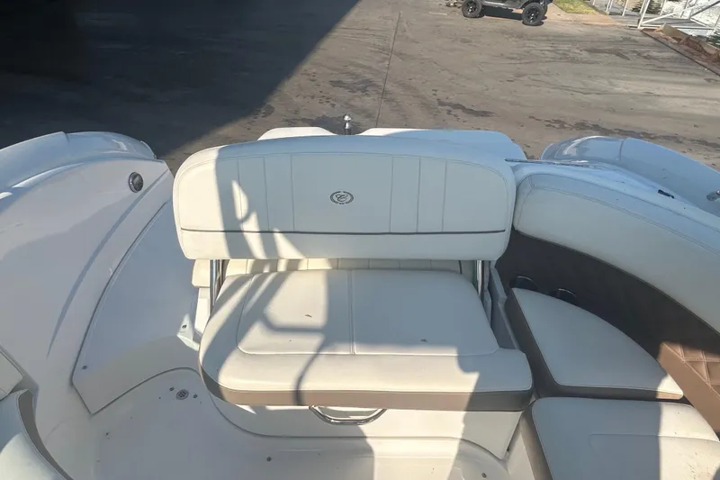 Slide: The Image of 2011 Cobalt 242 boat interior with white seating and deck. - 8