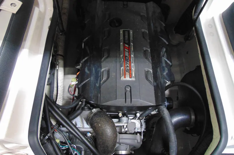 Slide: The Image of Engine compartment of 2020 Yamaha Boats 195S, showcasing powerful motor components. - 10