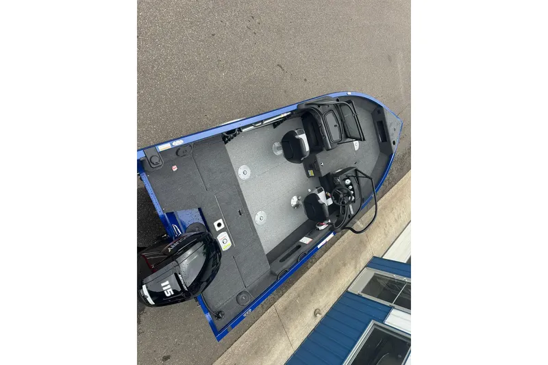 Slide: The Image of 2025 Crestliner 1750 Hawk boat, blue exterior, spacious interior, dual seats, Mercury 115 engine. - 11