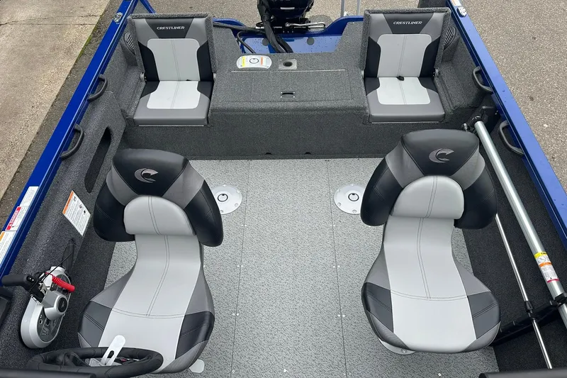 Slide: The Image of 2025 Crestliner 1750 Hawk boat interior with gray and black seating. - 14
