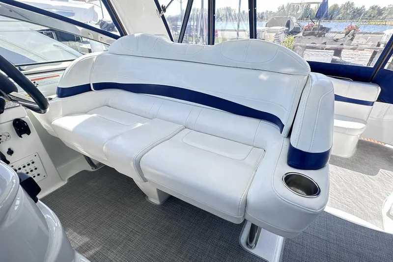 Slide: The Image of 2007 Formula 40 Performance Cruiser interior with white seating and blue accents. - 12