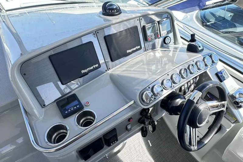 Slide: The Image of 2007 Formula 40 Performance Cruiser helm with Raymarine electronics and sleek dashboard design. - 14