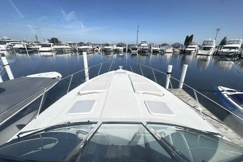 Slide: The Image of 2007 Formula 40 Performance Cruiser docked at a marina, surrounded by boats. - 15