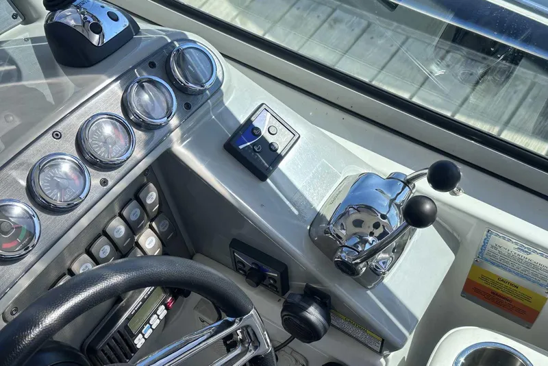 Slide: The Image of Control panel of a 2007 Formula 40 Performance Cruiser with gauges and throttle levers. - 16