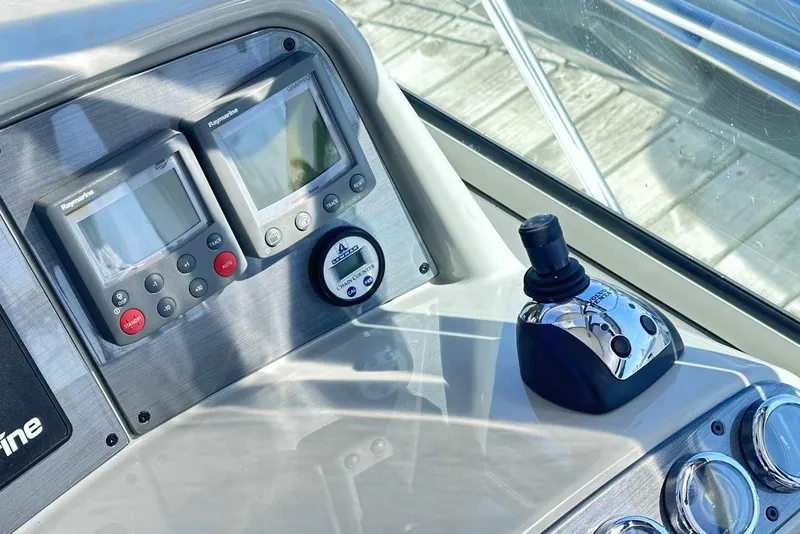 Slide: The Image of Control panel of 2007 Formula 40 Performance Cruiser with navigation instruments and joystick. - 17