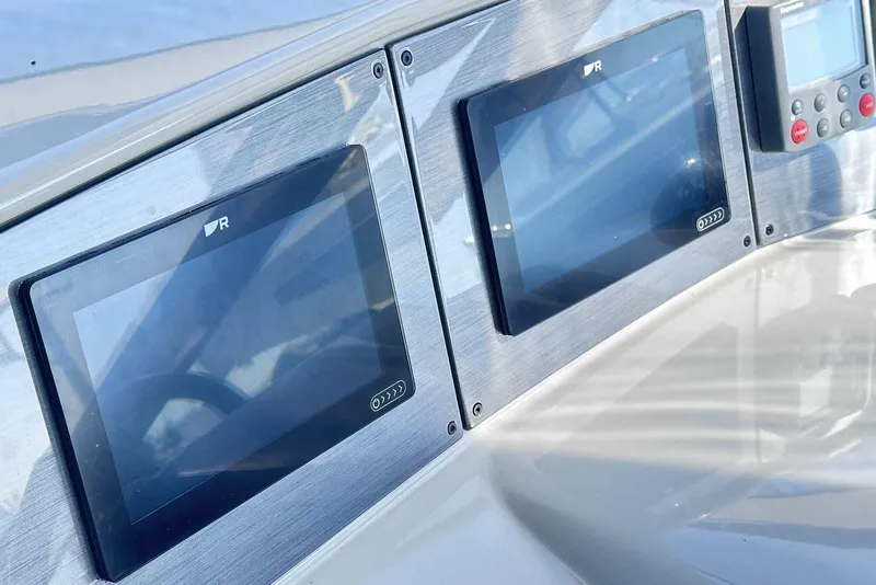 Slide: The Image of Dashboard of 2007 Formula 40 Performance Cruiser with modern navigation screens. - 18