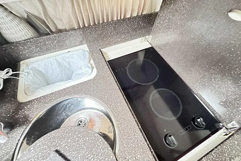 Slide: The Image of 2007 Formula 40 Performance Cruiser kitchen with stove and sink. - 27