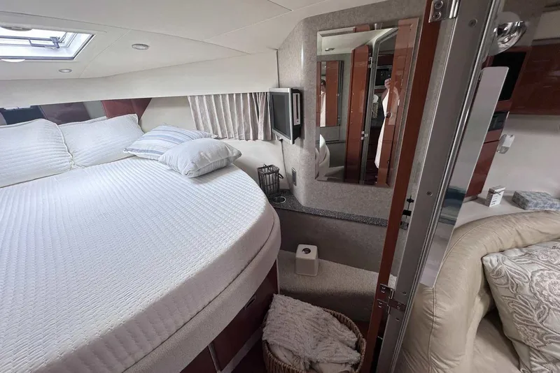 Slide: The Image of Luxurious interior of a 2007 Formula 40 Performance Cruiser with cozy bedding and elegant decor. - 30