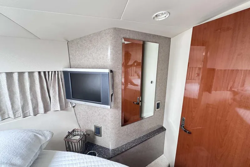 Slide: The Image of Interior of 2007 Formula 40 Performance Cruiser with TV, mirror, and wooden door. - 31