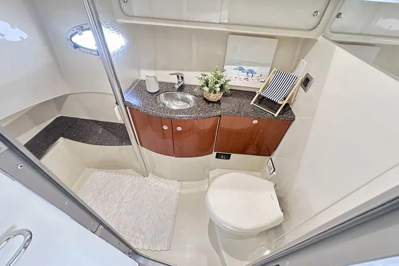 Slide: The Image of 2007 Formula 40 Performance Cruiser bathroom with sink, toilet, and decorative elements. - 39