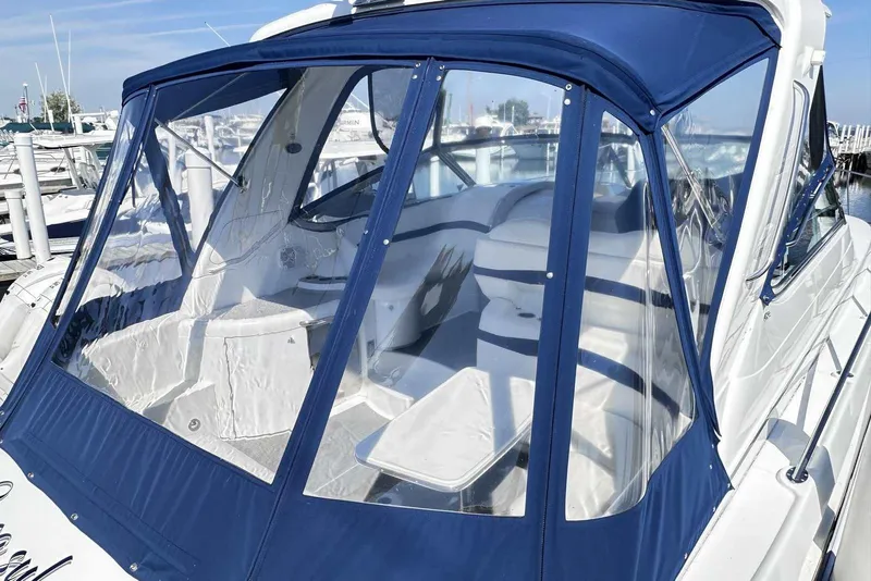 Slide: The Image of 2007 Formula 40 Performance Cruiser with blue canopy docked at marina. - 4