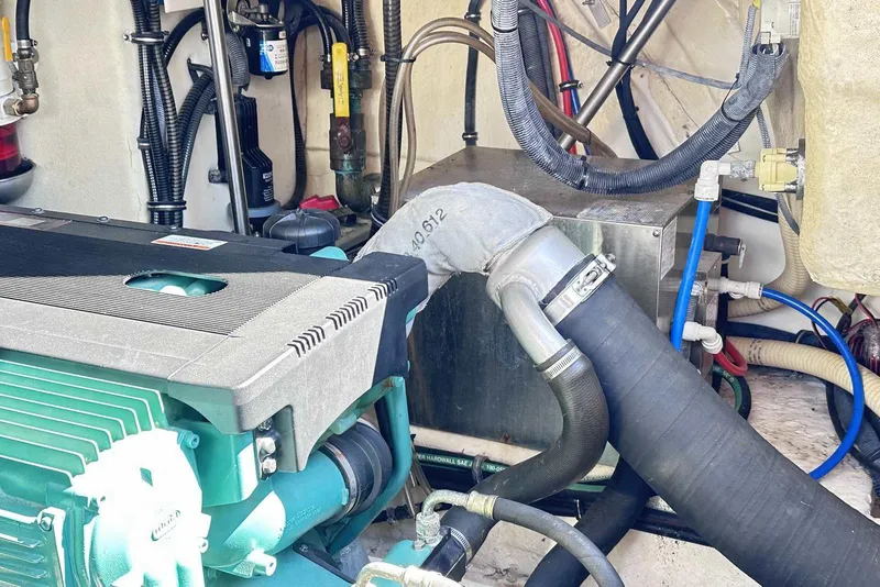 Slide: The Image of Engine compartment of a 2007 Formula 40 Performance Cruiser with visible hoses and components. - 48