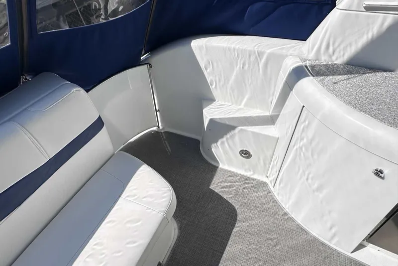 Slide: The Image of Interior of a 2007 Formula 40 Performance Cruiser with white seating and blue accents. - 7