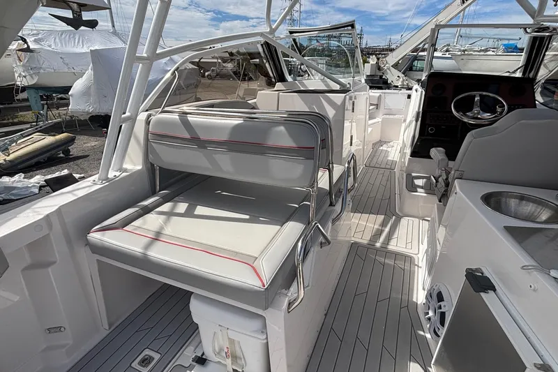 Slide: The Image of 2024 Solara S-250 DC boat interior with seating, steering wheel, and sink. - 10