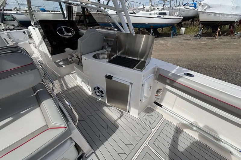 Slide: The Image of 2024 Solara S-250 DC boat interior with sleek seating and modern amenities. - 14