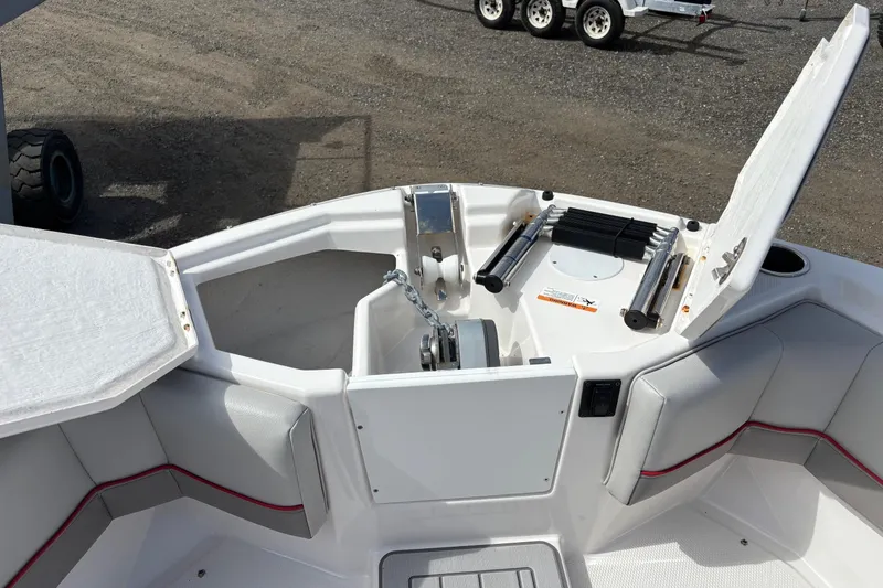 Slide: The Image of 2024 Solara S-250 DC boat bow with anchor storage and seating area. - 6
