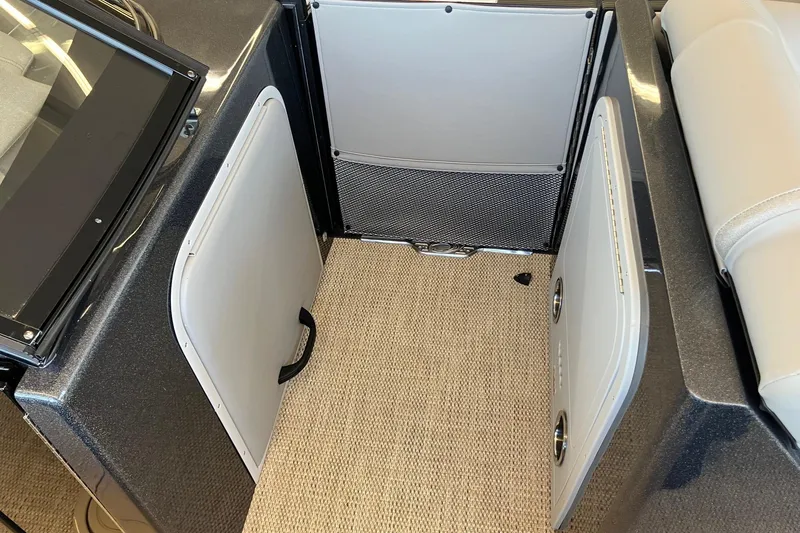 Slide: The Image of Interior of 2026 Crest Continental 250 SLC boat with storage compartments. - 12