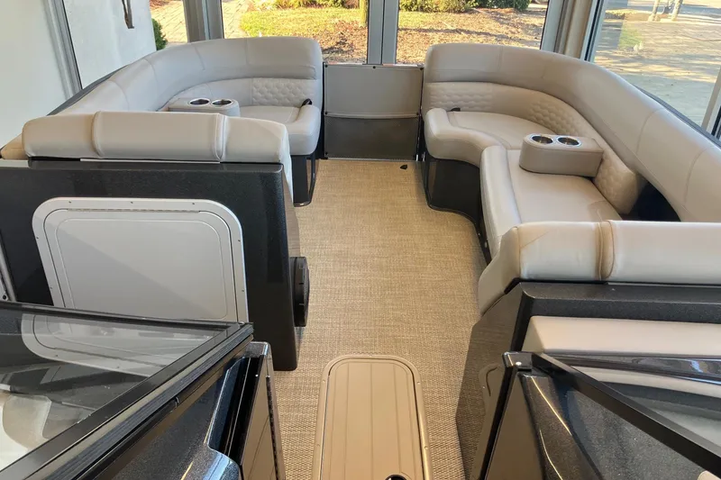 Slide: The Image of Luxurious interior of 2026 Crest Continental 250 SLC pontoon boat with plush seating. - 14