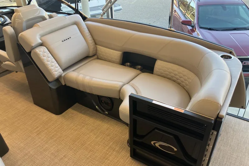 Slide: The Image of Luxurious seating in 2026 Crest Continental 250 SLC boat, featuring plush beige upholstery. - 5