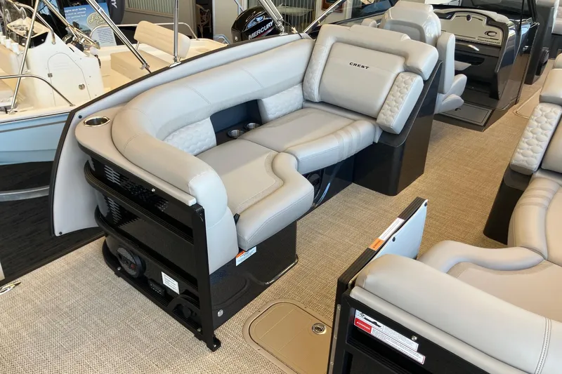 Slide: The Image of Luxurious seating on 2026 Crest Continental 250 SLC pontoon boat interior. - 6