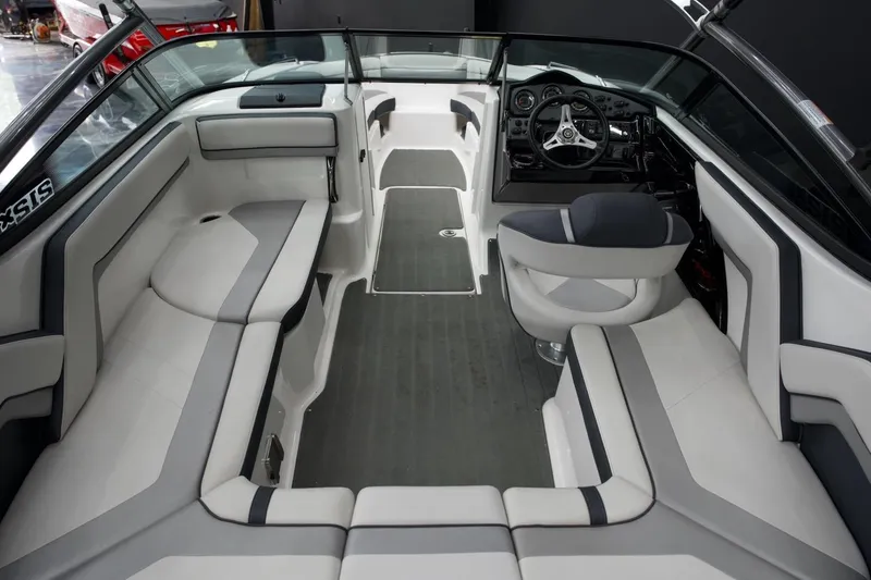 Slide: The Image of 2015 Yamaha Boats 212X interior with sleek seating and modern dashboard design. - 11