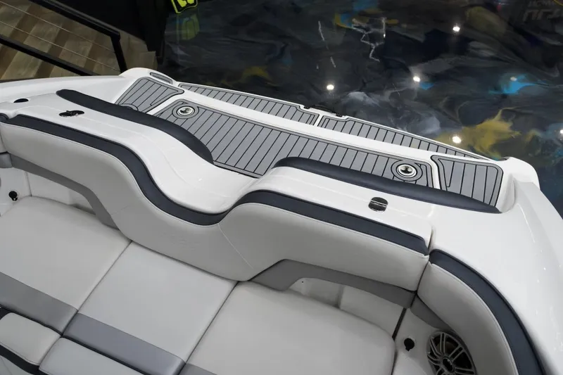 Slide: The Image of 2015 Yamaha Boats 212X swim platform with cushioned seating and sleek design. - 14