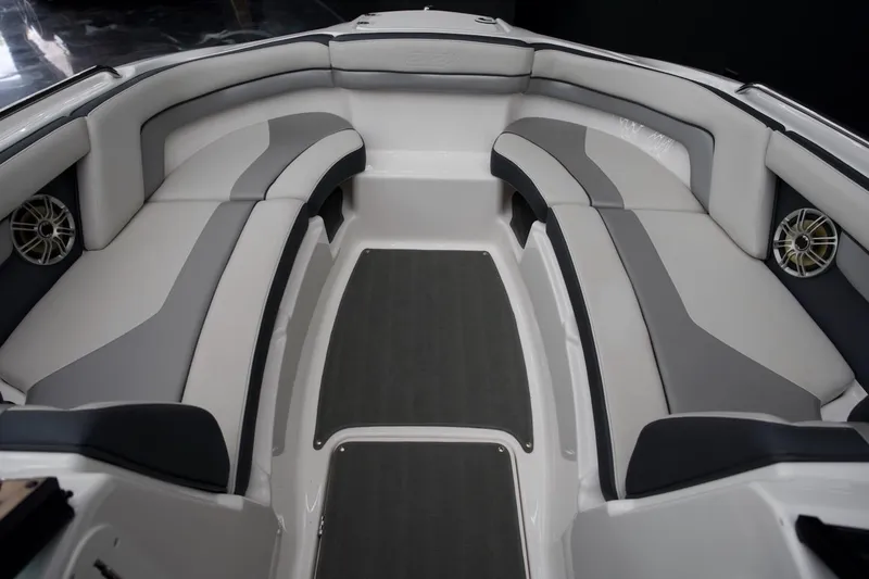 Slide: The Image of 2015 Yamaha Boats 212X interior with gray and white seating, featuring built-in speakers. - 5