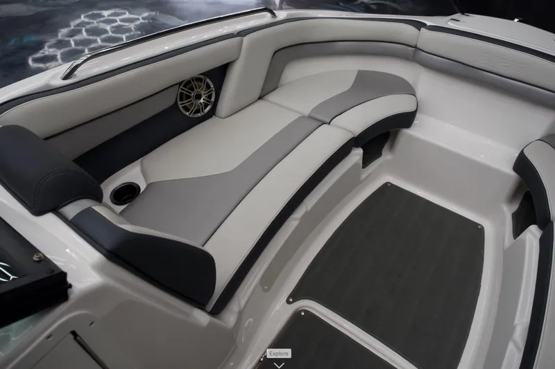 Slide: The Image of 2015 Yamaha Boats 212X interior with gray seating and speaker detail. - 7