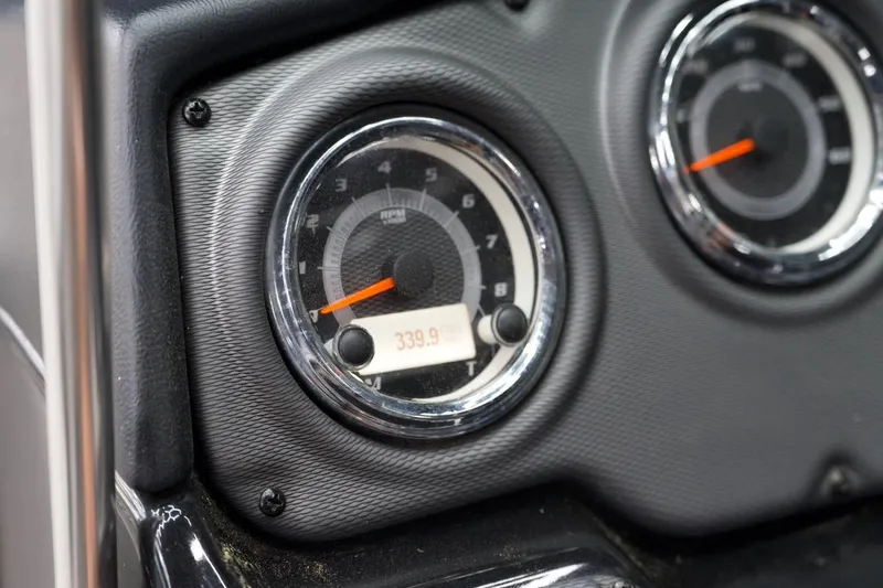Slide: The Image of Close-up of 2015 Yamaha Boats 212X dashboard gauges displaying RPM and hours. - 9