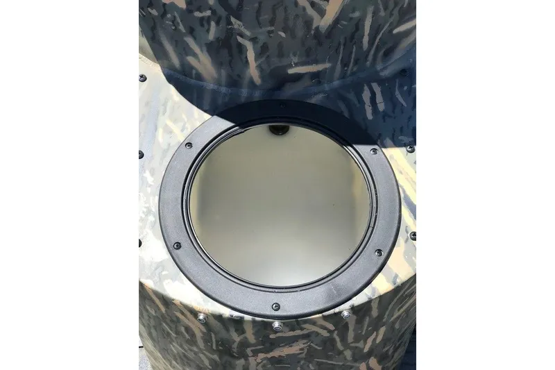 Slide: The Image of War Eagle Blackhawk 961, 2026 model, featuring a camo-patterned circular hatch. - 11