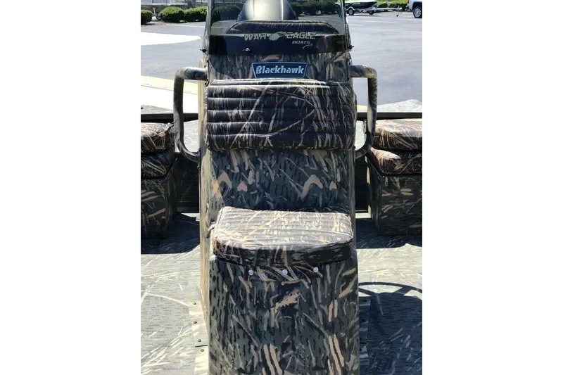 Slide: The Image of 2026 War Eagle Blackhawk 961 boat with camouflage seating and console design. - 13