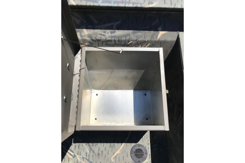 Slide: The Image of Open storage compartment in 2026 War Eagle Blackhawk 961 boat, showing interior details. - 3