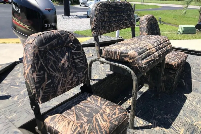 Slide: The Image of 2026 War Eagle Blackhawk 961 boat with camo seats and Yamaha 115 engine. - 8