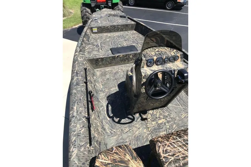 Slide: The Image of 2026 War Eagle Blackhawk 961 boat with camouflage design and steering console. - 9