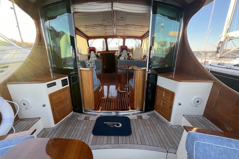 Slide: The Image of 2013 Hinckley Talaria 48 MY yacht interior with elegant wood finishes and seating. - 10