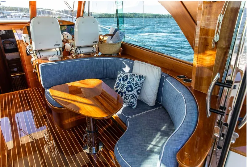 Slide: The Image of Luxurious interior of 2013 Hinckley Talaria 48 MY yacht with elegant seating and wooden finishes. - 12