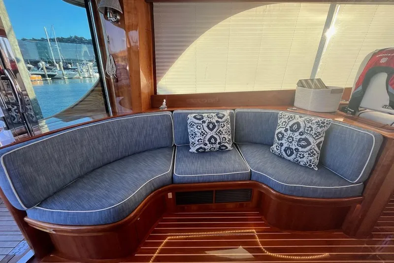 Slide: The Image of Luxurious seating area on a 2013 Hinckley Talaria 48 MY yacht with marina view. - 14